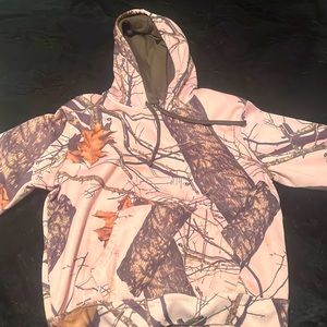 This hoodie is a pink camo the brand is mossy oak it’s super comfy and so cute!!